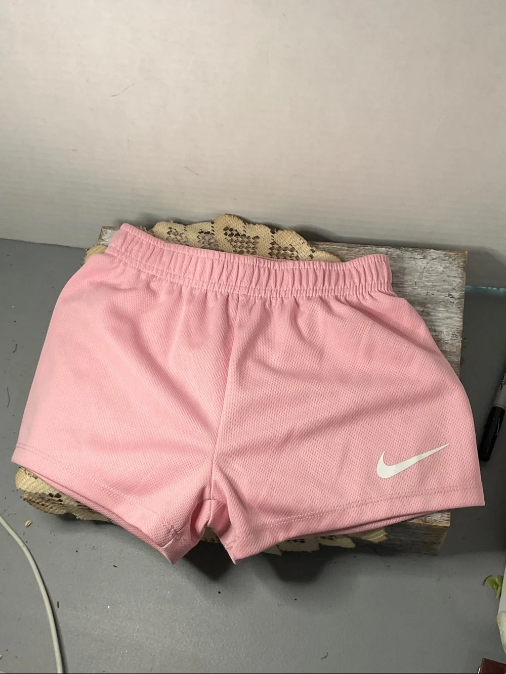 Nike Light Pink Athletic Shorts with White Swoosh
